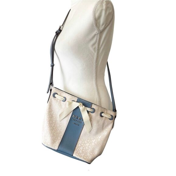 DKNY Ivory Cream and Blue Trims Lace Bow Front Bucket Style Crossbody Purse Bag - Picture 1 of 14